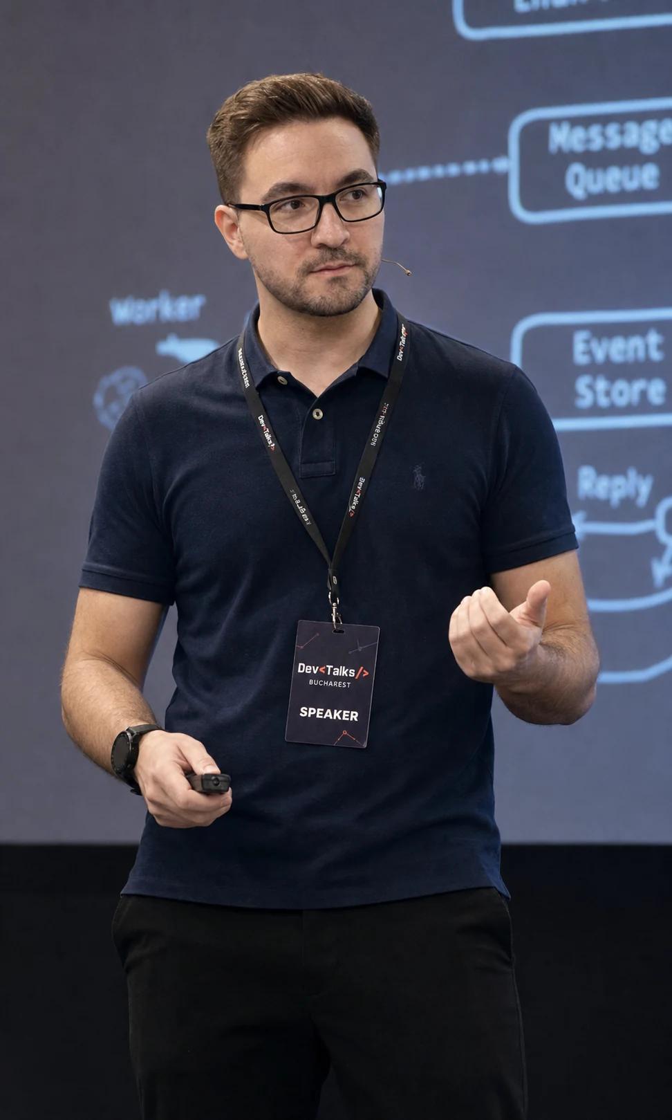 Lucian Oprea presenting a backend engineering talk at DevTalks Bucharest